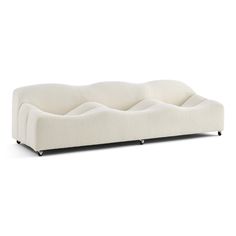 a white couch with wheels on it