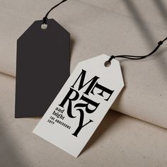 a black and white tag with the words merry on it