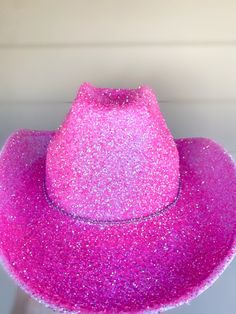 Pink glitter cowboy hat. This cowboy hat is great for parties, events, and even cute photos! This is an adult sized, felt cowboy hat. (One size fits most). The hat circumference is 23 inches. Glitter has been sealed so it will not easily come off! We hope you will love this stunning hat as much as we do! You can customize this hat with any color glitter you want just message us or put it in the personalization section! No returns offered. Love, The Disco Cowgirls💋 Hot Pink Cowgirl Hats, Pink Bedazzled Cowboy Hat, Pink Sparkly Cowboy Hat, Pink Party Accessories, Hot Pink Cowgirl Party, Pink Cowboy Party, Disco Aesthetic Party, Hot Pink Cowgirl Hat, Rhinestone Cowgirl Hat