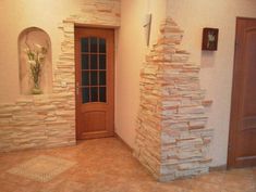 an entry way with stone walls and doors