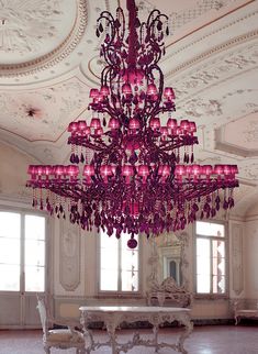 a large chandelier hanging from the ceiling in a room