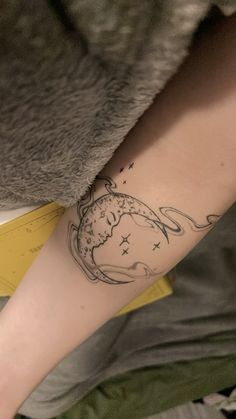 a person with a tattoo on their arm