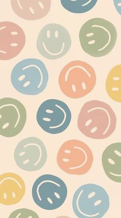 an abstract pattern with smiley faces in pastel colors on a white background that looks like circles