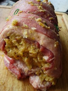 the ham is cut in half and ready to be eaten on the cutting board for consumption