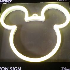 the mickey mouse neon sign is on display