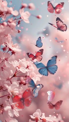 many butterflies flying around in the sky with pink and white flowers on it's side