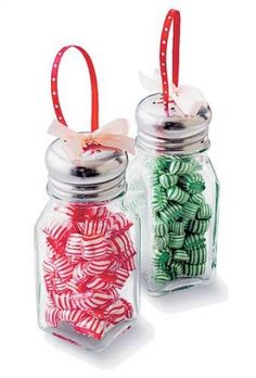 two glass jars filled with candy canes next to each other