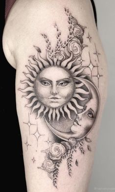 a woman's arm with a sun and moon tattoo on it