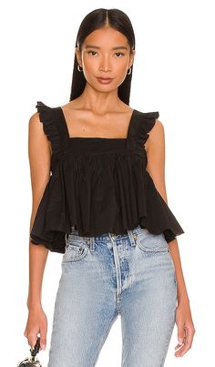 Find SELKIE The Caviar Ruffle Apron Top on Editorialist. Selkie The Caviar Ruffle Apron Top in Black. - size 4X (also in 5X, 6X, XXL) Selkie The Caviar Ruffle Apron Top in Black. - size 4X (also in 5X, 6X, XXL) 100% cotton. Made in China. Machine wash. Hidden side zipper closure. Flutter sleeves. Oversized bow detail at back. Pleated hem. SLKR-WS30. SKPC1162. Meet Selkie: fanciful, nostalgic and extra romantic. Started by former Wildfox Co-Founder Kimberley Gordon, this ready-to-wear collection Whimsical Clothing, Apron Top, College Gameday Outfits, Ruffle Apron, Female Friendship, Black Sleeveless Top, Gameday Outfit, Fashion Help, Flutter Sleeves