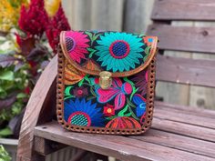 Celebrate artisan craftsmanship with our exquisite handmade Mexican crossbody purse crafted from premium leather. This one-of-a-kind accessory seamlessly blends traditional Mexican design with modern functionality.  Each purse is meticulously crafted by skilled artisans, showcasing intricate tooling and vibrant colors that reflect the rich cultural heritage of Mexico.  The compact yet spacious design ensures practicality without compromising style, making it the perfect companion for any occasio Traditional Hand Tooled Shoulder Bag As A Gift, Traditional Hand Tooled Bag For Festivals, Bohemian Hand-stitched Shoulder Bag As Gift, Traditional Hand-tooled Bag For Festivals, Traditional Hand-tooled Crossbody Shoulder Bag, Traditional Crossbody Bag With Multicolor Embroidery, Mexican Made Purse, Mexican Bags Handbags, Traditional Hand Tooled Pouch Bag