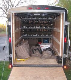 the back end of a trailer filled with items