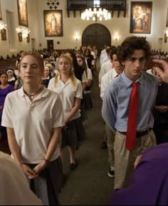 a group of people standing in a church