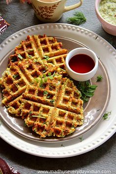 some waffles are sitting on a white plate