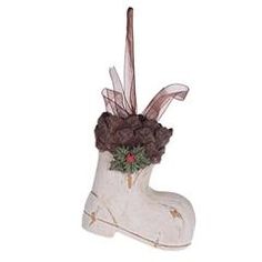 a white boot decorated with flowers and ribbon on the top, sitting in front of a white background