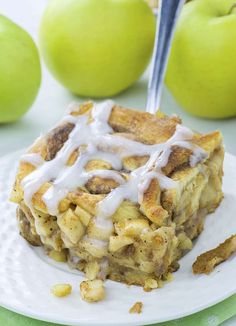 a plate with some food on top of it and apples in the backgroud