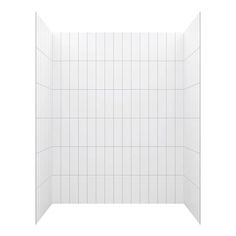 a white tiled shower stall with no curtain