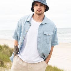 "Relaxed, loose, and breathable linen shirt with short/elbow sleeves; Worn well as a shirt or overshirt; Traditional point collar, relaxed shoulders, and round hem; Button-front closure; Front chest pocket; The model is 183 cm high (72\"), size L, wearing the jacket in L; The model is wearing a shirt in Swedish blue paired with Albury pants in oat milk;" Linen Short Sleeve Shirt With Camp Collar For Beach, Linen Camp Shirt With Pockets For Beach, Beach Linen Camp Shirt With Pockets, Unstructured Linen Camp Shirt With Pockets, Collared Linen Short Sleeve Shirt For Beach, Casual Linen Short Sleeve Shirt, Summer Short Sleeve Linen Shirt With Rolled Sleeves, Summer Linen Short Sleeve Shirt With Rolled Sleeves, Casual Linen Short Sleeve Shirt With Camp Collar