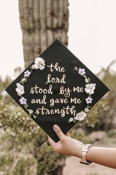 a graduation cap that says the lord stood by me and gave me strength