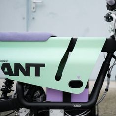 the front end of a green and purple bike