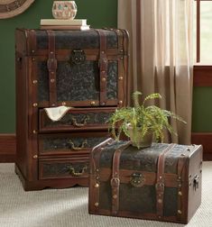 two pieces of luggage sitting next to each other in front of a window with curtains