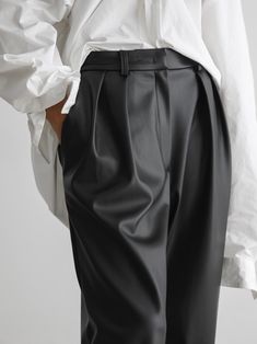 Loose fit vegan leather trousers with low waist, double pleated waistband and belt loops. Made from high quality PU. Fabric contains natural stretch. Model is in MINUSEY S. ✔️ Free worldwide express shipping over $100✔️ Loved by 6,500+ customers✔️ Limited edition collections, maximum style⠀⠀⠀⠀⠀⠀⠀⠀⠀Stay ahead of the trend with can’t-find-anywhere-else staples. Your closet will thank you 💕* MINUSEY S = EU 34, US 2* MINUSEY M = EU 36, US 4* 100% PU Leather* Hand wash cold or professional clean* Made in Korea - Model Height: 169cm/5'6" (US2, EU34) Business Casual High-waisted Leather Pants With Belt Loops, High-waisted Leather Pants For Business Casual With Belt Loops, Business Casual High-waisted Leather Pants, Wide Leg Leather Pants With Belt Loops For Work, Sleek Leather Straight Pants With Belt Loops, Sleek Straight Leather Pants With Belt Loops, Sleek High Waist Leather Pants With Belt Loops, Sleek High-waisted Leather Pants With Belt Loops, Classic Straight Leather Pants With Belt Loops