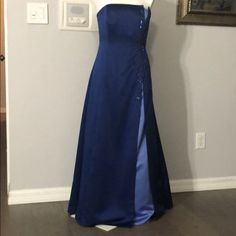 Beautiful Size 8 Dark Blue Formal Gown With Light Blue Accents And Stunning Bead Design With Matching Sash Never Worn (Each Side Of Sash Matches One Of The Two Blue Tones Of The Dress.) Wear The Dark Blue Side Outwards To Match The Main Dress Color Or The Lighter Blue Almost Periwinkle Color Outwards Which Adds Contrast And Brings Out The Lighter Accents In This Gorgeous Gown!!! It’s Only Been Worn Once To My Sisters Wedding Ceremony And Is In Perfect Condition Freshly Dry Cleaned Blue Strapless Evening Dress For Formal Occasions, Formal Blue Strapless Evening Dress, Blue Strapless Embellished Evening Dress, Blue Satin Ball Gown Dress, Blue Satin Gown With Sweep Train, Blue Satin Floor-length Gown, Blue Strapless Satin Evening Dress, Blue Strapless Bridesmaid Evening Dress, Blue Formal Maxi Dress Ball Gown