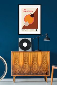 an old fashion record player sitting on top of a wooden cabinet