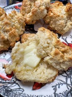 biscuits with butter are on a floral plate