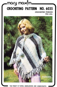 a woman wearing a crocheted poncho with fringes on the shoulders