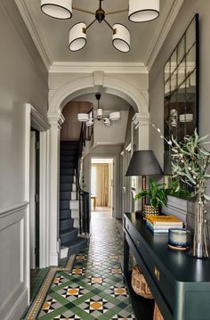 the hallway is decorated in green and white with black accents, including a checkerboard floor