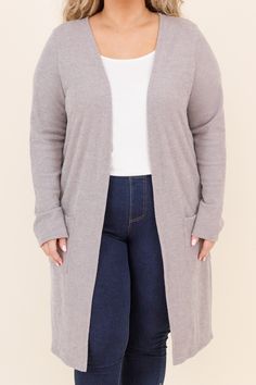 This cardigan was made for cuddle weather! It has a solid neutral color you can style for every occasion! It's comfortable for all day wear, has a figure-flattering fit, and even features pockets! Simply pair this cardigan with a patterned top or basic dress for an easy everyday look! 90% Polyester, 5% Rayon, 5% Spandex Made in the USA. Gray Sweater With Pockets For Loungewear, Solid Loungewear Sweater Coat With Pockets, Cozy Solid Color Sweater Coat For Everyday, Comfortable Everyday Soft Knit Outerwear, Cozy Fit Soft Knit Everyday Cardigan, Cozy Everyday Cardigan, Gray Soft Knit Cardigan For Everyday, Gray Soft Knit Everyday Cardigan, Gray Relaxed Fit Cardigan With Pockets