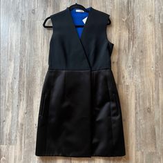 New With Tags, Never Worn. Authentic Celine From The Phoebe Philo Era. Black Dress With Blue Inside. Inner Button And Outer Hook Closure At The Front. Approximate Measurements Bust 35.5”, Hips 40”, Length 36.75”, Waist 33.25” Black Silk Semi-formal Dress, Black Silk Midi Dress For Work, Black A-line Dress For Work, Silk A-line Mini Dress For Work, Black Career Dresses For Spring, Black Sheath Midi Dress For Semi-formal Occasions, Black Sheath Dress For Semi-formal Occasions, Black Career Dresses, Career A-line Dresses