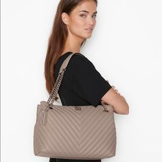 Victoria’s Secret The Shoulder V-Quilt Tote Bag Condition: New In Package Size: 4" L X 5.9" D X 10.2" H Strap Drop: 9.4” Color: Taupe Polished And Classic, Always Ready To Work. This Bag Combines Both Fashion And Function In One Wear-Everywhere Style That’s Perfect To Tote Your Laptop. In Our Signature V-Quilt Finish With V Monogram Hardware. Fits: Phone, Wallet, Keys, A Small Laptop And Everyday Essentials Open Top With Snap Closure 1 Interior Zipper Pocket Imported Polyurethane Elegant Taupe Shoulder Bag With Silver-tone Hardware, Chic Gray Shoulder Bag For Errands, Elegant Victoria's Secret Tote Shoulder Bag, Elegant Victoria's Secret Shopping Bags, Elegant Victoria's Secret Bags For Daily Use, Everyday Elegant Victoria's Secret Shoulder Bag, Elegant Victoria's Secret Shoulder Bag For Everyday, Elegant Everyday Victoria's Secret Shoulder Bag, Chic Victoria's Secret Shoulder Bag For Errands