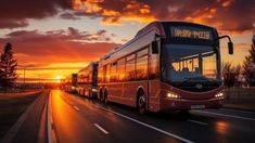 a red bus driving down a street at sunset with the sun going down behind it