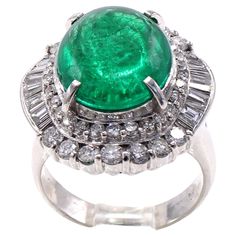 Beautifully designed and masterfully handcrafted platinum emerald diamond cocktail ring featuring a Colombian cabochon emerald weighing 5.01 carats. The perfectly cut cabochon displays a strongly saturated forest green and is embellished by bright white and sparkly round brilliant cut and baguette cut diamonds. An absolutely gorgeous piece of jewelry on the finger with a wonderful contrast of colors. Ring size 5.5 and can be sized. Emerald Drop Earrings, Emerald Earrings Drop, Oxidized Silver Rings, Diamond Cocktail Ring, Star And Moon, Ruby Diamond Rings, Platinum Diamond Rings, Colorless Diamond, Colombian Emeralds