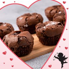 chocolate muffins on a cutting board with hearts in the background