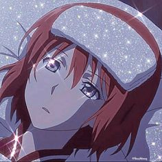 a girl with red hair wearing a white hat and looking at the camera while standing in front of stars