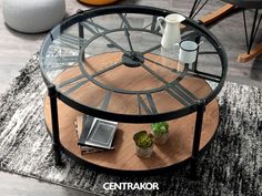 a coffee table with a glass top on a rug in a living room or dining room