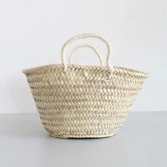 a woven basket sitting on top of a table