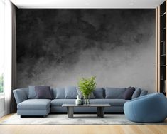 a living room with a couch, chair and coffee table in front of a black wall