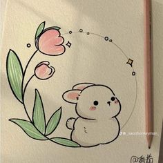 a drawing of a little bunny with flowers on it's side and a pencil in the foreground