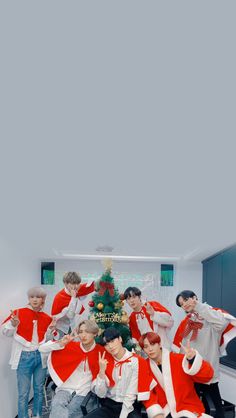 group of boys in red and white outfits posing for the camera