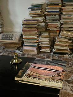 a stack of books sitting on top of a table