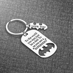 a batman keychain with the words love you to the moon and back