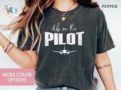 "The Models in the pictures are wearing 1 or 2 sizes up, Please order 1 or 2 sizes up for an oversized look.Comfort Color Dibs On The Pilot, Pilot Shirt, Pilot Gifts, Aviation Gifts, Pilot Tshirt, Pilot Girlfriend Tee, Airplane Shirt, Air Force, Pilot Wife Shirt, Plane Shirt, Aviation Shirt, Airplane T-shirt, Airplane Gift Welcome to my store. I care about your happiness and try to produce original designs for you. If you are wondering how this design looks on other products please click the following links;  Please contact me if you have a request to customize designs. PRODUCT FEATURES ♥ DTG Print, Comfort Color 1717   The designs you see glitter on the products are not sim. only glitter image is used. CARE INSTRUCTIONS ♥ DO Inside out before wash, ♥ DO warm/cold machine wash, ♥ Wash with Pilot Girlfriend, Pilot Party, Pilot Wife, Airplane Gifts, Airplane Shirt, Pilot Shirt, Air Force Pilot, Pilot Gifts, The Pilot