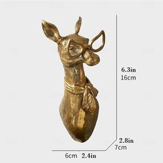 a brass deer head with glasses on it's face and measurements for the size