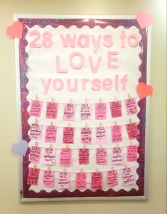 a bulletin board that says 28 ways to love yourself with pink and red hearts on it