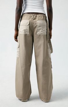 Level up your streetwear style with the PacSun Brown Toggle Baggy Cargo Pants. These on-trend mid-rise pants combine edgy style with comfort, featuring a baggy fit, cargo pockets, and an adjustable toggle waist for a customizable fit. Streetwear Straight Parachute Pants With Patch Pockets, Summer Cargo Pants With Hip Pockets For Streetwear, Urban Baggy Parachute Pants With Hip Pockets, Utility Parachute Pants For Streetwear, Hip Hop Style Straight Leg Outdoor Bottoms, Urban Baggy Cargo Parachute Pants, Baggy Urban Style Parachute Pants With Wide Legs, Baggy Urban Style Wide-leg Parachute Pants, Urban Style Baggy Parachute Pants With Wide Legs