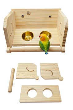 a toy bird sitting on top of a wooden box