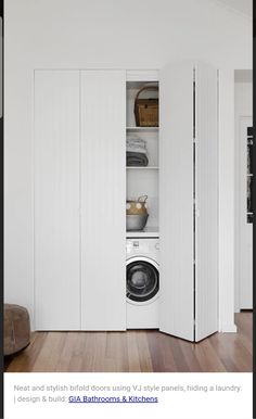 an empty room with a washer and dryer next to it on the floor